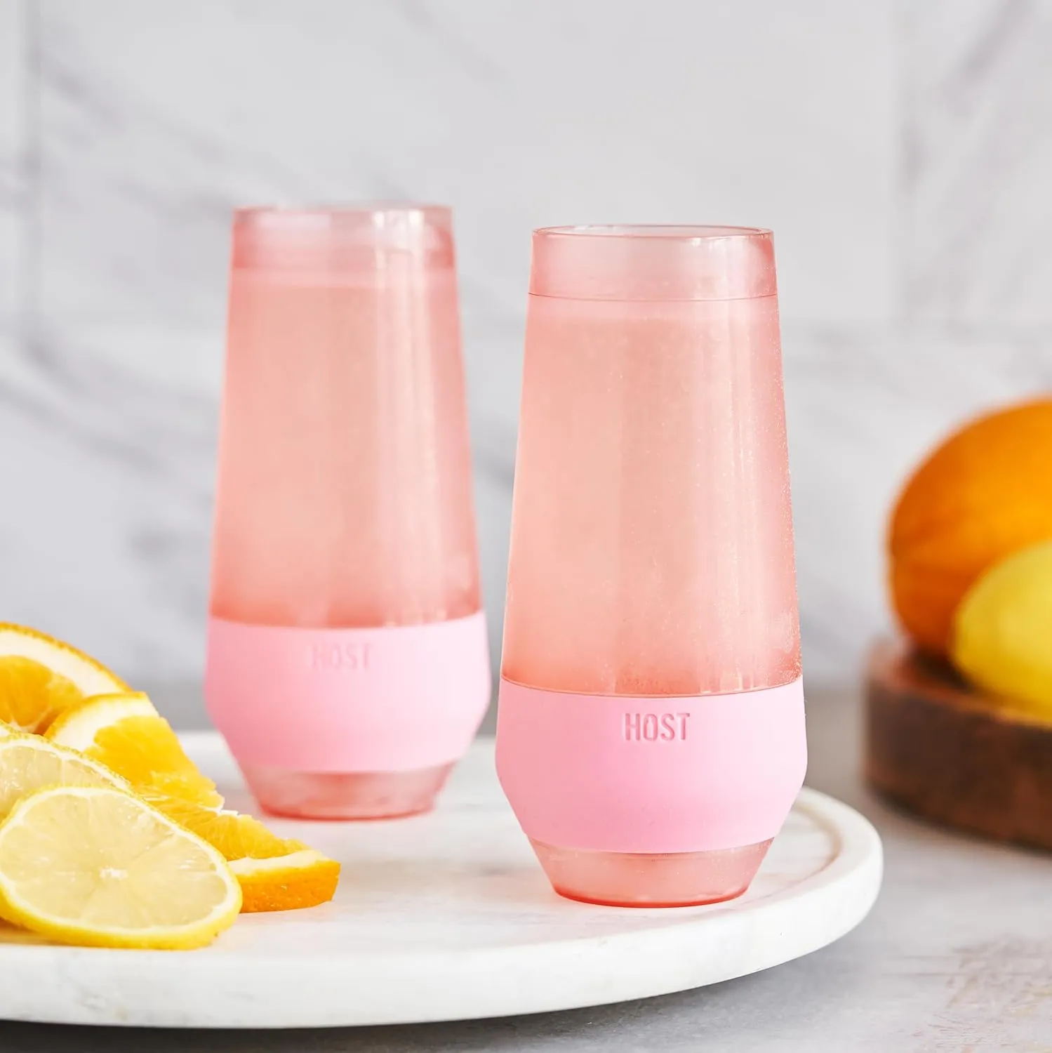 HOST Champagne Freeze Double-Walled Stemless Wine Glasses Freezer Cooling Cups with Active Cooling Gel and Insulated Silicone Grip, 9 Oz Plastic Tumblers, Blush Tint, Set of 2